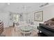 Bright living room with a piano, comfortable seating, and built-in shelving at 1291 Interlaken Pass, Jonesboro, GA 30238