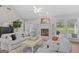 Bright living room featuring a fireplace, white sofas, and neutral decor at 1291 Interlaken Pass, Jonesboro, GA 30238