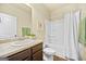 Well-lit bathroom with spacious countertop, a tub, and a shower, complete with wood-look floors at 2385 Aukerman Trce # 80, Hampton, GA 30228