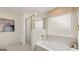 Bathroom featuring a soaking tub and glass enclosed shower at 1813 Quaker St, Hampton, GA 30228