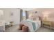 This stylish bedroom is decorated with a pink accent wall, modern art and designer zebra-stripe curtains at 1813 Quaker St, Hampton, GA 30228