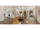 Welcoming entryway with staircase, modern chandelier, and a seamless transition to the living area at 1813 Quaker St, Hampton, GA 30228