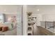 Upstairs hallway featuring a view of a bedroom and built in shelving at 1813 Quaker St, Hampton, GA 30228