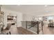 Bright hallway with wood floors leads to an open living area and a view of the main bedroom at 1813 Quaker St, Hampton, GA 30228