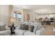 Comfortable living room filled with natural light showcasing an open layout with views to the kitchen at 1813 Quaker St, Hampton, GA 30228