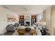 Spacious living room with a fireplace, stylish furnishings, and great natural light creating an inviting space at 1813 Quaker St, Hampton, GA 30228