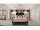 Spacious main bedroom with tray ceiling, sitting area, and neutral decor at 1813 Quaker St, Hampton, GA 30228