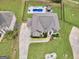 Aerial shot of a backyard oasis featuring a swimming pool, seating area, and lush greenery at 3709 Royer Ln # 23, Hampton, GA 30228