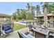 Relaxing backyard with a swimming pool, lounge chairs, and an inviting outdoor seating area on the wooden deck at 3709 Royer Ln # 23, Hampton, GA 30228