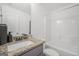 Bathroom with granite counter, integrated sink, and a shower/tub combo at 3709 Royer Ln # 23, Hampton, GA 30228