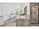 Bright bathroom featuring soaking tub, tiled shower, double vanity, and a window letting in natural light at 3709 Royer Ln # 23, Hampton, GA 30228