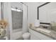 Stylish bathroom with granite countertops, shower with gray tile, and a modern vanity at 3709 Royer Ln # 23, Hampton, GA 30228