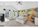 Bright bedroom with vaulted ceilings, geometric mural, soft carpet, and two large windows at 3709 Royer Ln # 23, Hampton, GA 30228