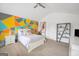 Bedroom with a vaulted ceiling, colorful geometric wall art, and plush carpet at 3709 Royer Ln # 23, Hampton, GA 30228