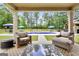 Inviting covered patio seating area with a clear view of the sparkling pool and well-maintained backyard at 3709 Royer Ln # 23, Hampton, GA 30228