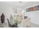 Elegant dining room features modern chandelier, glass table, and decorative accents at 3709 Royer Ln # 23, Hampton, GA 30228