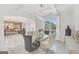 Bright dining room with a glass table, upholstered chairs, and coffered ceiling, creating an elegant and inviting atmosphere at 3709 Royer Ln # 23, Hampton, GA 30228
