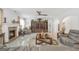 Spacious living room features a brick fireplace, hardwood floors, and modern decor at 3709 Royer Ln # 23, Hampton, GA 30228