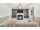 Inviting living room featuring a cozy fireplace and built-in shelving, perfect for entertaining at 3709 Royer Ln # 23, Hampton, GA 30228