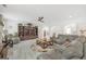 Bright living room boasts hardwood floors, ceiling fan, and a comfortable sectional couch at 3709 Royer Ln # 23, Hampton, GA 30228