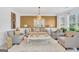 Stylish living room showcasing modern furniture, a decorative mirror, and ample natural light at 3709 Royer Ln # 23, Hampton, GA 30228