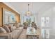Inviting living room with a fireplace, comfortable seating, and marble floors illuminated by natural light at 3709 Royer Ln # 23, Hampton, GA 30228