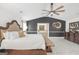 Bright bedroom showcasing neutral design with door that leads into ensuite bathroom at 3709 Royer Ln # 23, Hampton, GA 30228