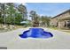 Stunning pool with adjacent lounge chairs and a luxurious outdoor kitchen, perfect for summer gatherings at 3709 Royer Ln # 23, Hampton, GA 30228