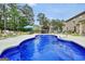 Inviting backyard pool with bar and lounge chairs, perfect for relaxation and summer entertainment at 3709 Royer Ln # 23, Hampton, GA 30228