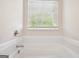Modern bathroom featuring a soaking tub at 4376 Grant Forest Cir, Ellenwood, GA 30294