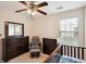 Comfortable Bedroom with dark wood furniture, ceiling fan and plenty of natural light at 4376 Grant Forest Cir, Ellenwood, GA 30294