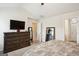 Spacious bedroom showcases a dresser, large mirror, and doorway leading to other areas of the home at 4376 Grant Forest Cir, Ellenwood, GA 30294
