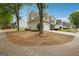 Suburban home exterior with trees, lawn, and driveway at 4376 Grant Forest Cir, Ellenwood, GA 30294
