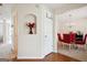 Entryway featuring hardwood floors, an alcove with flowers, and a view of the dining room at 4376 Grant Forest Cir, Ellenwood, GA 30294