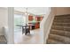 Well-lit kitchen with ample cabinet space, an island table, and access to the outdoor living area at 4376 Grant Forest Cir, Ellenwood, GA 30294