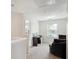 Home office area featuring neutral walls, plush chair, and a large window at 4376 Grant Forest Cir, Ellenwood, GA 30294