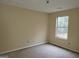 Bedroom features a neutral color palette, a window providing natural light, and a simple, uncluttered space at 1119 Oakwood Manor Ct, Decatur, GA 30032