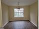 Spacious dining room featuring wood floors, a large window, and a stylish chandelier at 1119 Oakwood Manor Ct, Decatur, GA 30032