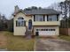 Charming two-story home featuring a traditional design with a two car garage and inviting front entrance at 1119 Oakwood Manor Ct, Decatur, GA 30032