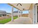 A covered back porch provides an outdoor space to relax and enjoy a quiet suburban neighborhood at 1808 Quaker St, Hampton, GA 30228