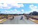 View of the community entrance with gates and well-maintained landscaping at 1808 Quaker St, Hampton, GA 30228