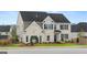 Attractive two-story home with a brick facade and well-maintained front yard at 1808 Quaker St, Hampton, GA 30228