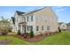 Charming two-story home with brick accents, a manicured lawn, and dark window shutters at 1808 Quaker St, Hampton, GA 30228