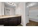 Bathroom featuring a single vanity, large mirror, and tile flooring at 2373 Aukerman Trce # 83, Hampton, GA 30228