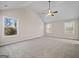 Spacious bedroom with vaulted ceilings, large windows, and plush carpeting at 2373 Aukerman Trce # 83, Hampton, GA 30228