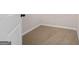 Neutral-toned carpet, bright white walls, and white baseboards create a clean look at 2373 Aukerman Trce # 83, Hampton, GA 30228