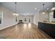 Spacious living room featuring wood floors, a fireplace, and plenty of natural light at 2373 Aukerman Trce # 83, Hampton, GA 30228