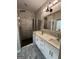 Bathroom showcasing white double vanity and a modern tiled shower at 59 S Old Hwy 27, Roopville, GA 30170
