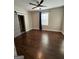 Bedroom featuring hardwood floors and a modern ceiling fan at 59 S Old Hwy 27, Roopville, GA 30170