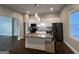 Modern kitchen featuring white cabinetry, granite countertops, and stainless steel appliances at 59 S Old Hwy 27, Roopville, GA 30170